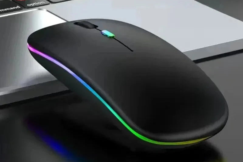 Matte black rechargeable wireless mouse with Bluetooth 5.2 and 2.4G connectivity on laptop