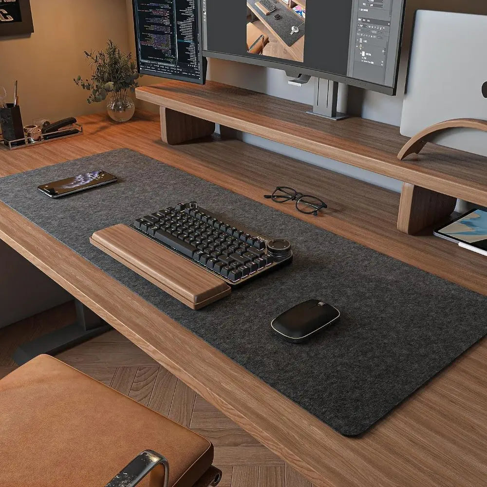 HandsCross large gaming desk mat in dark gray placed on wooden desk with keyboard and mouse